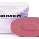 Future of diabetes care: A smart insulin patch on a person's arm for painless glucose management.