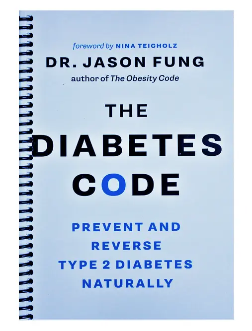 A stack of educational healthcare books on a wooden table with fresh apples