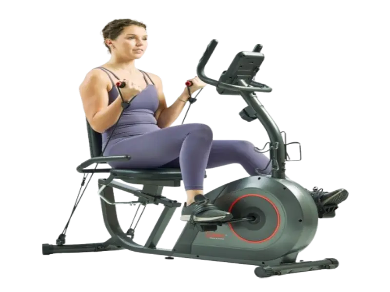 Senior exercising on a stationary bike at home
