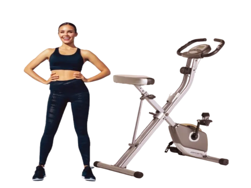 Woman standing beside a foldable exercise bike for home exercise