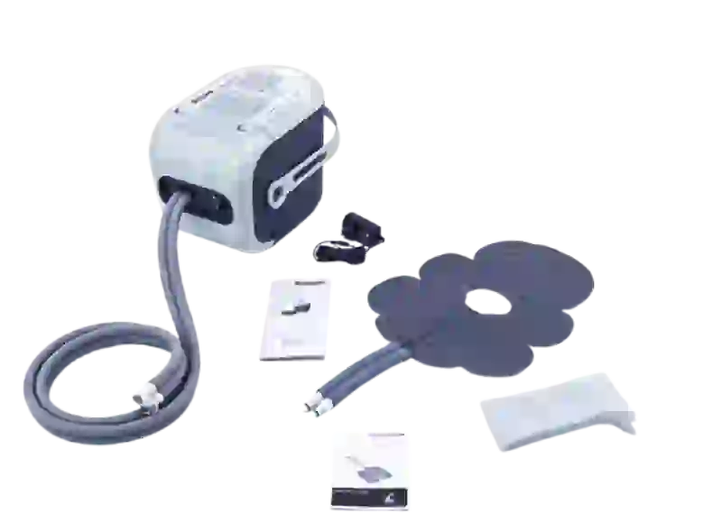 Ossur Cold Rush Therapy System machine with ergonomic pad on a table for knee and foot swelling relief
